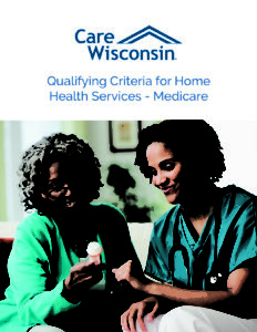 A smiling nurse and smiling elderly woman look at the label of a prescription bottle of pills