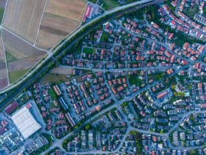 overhead photo of a town showing a neighborhood and farm fields